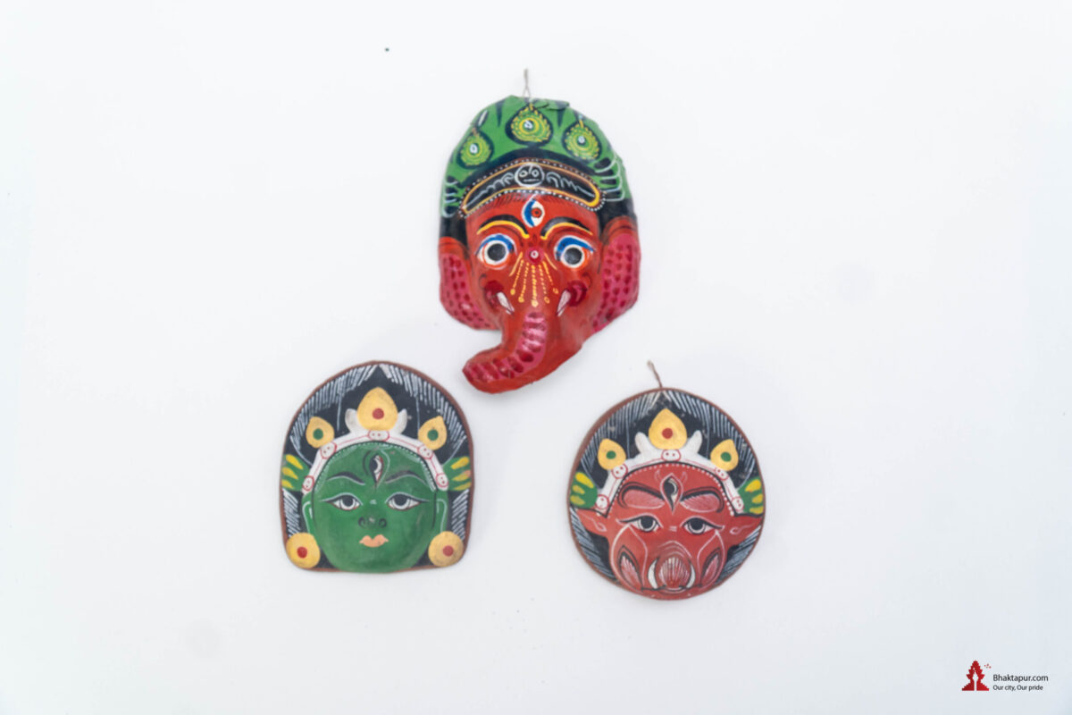 A set of three miniature cute clay masks