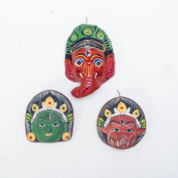 A set of three miniature cute clay masks