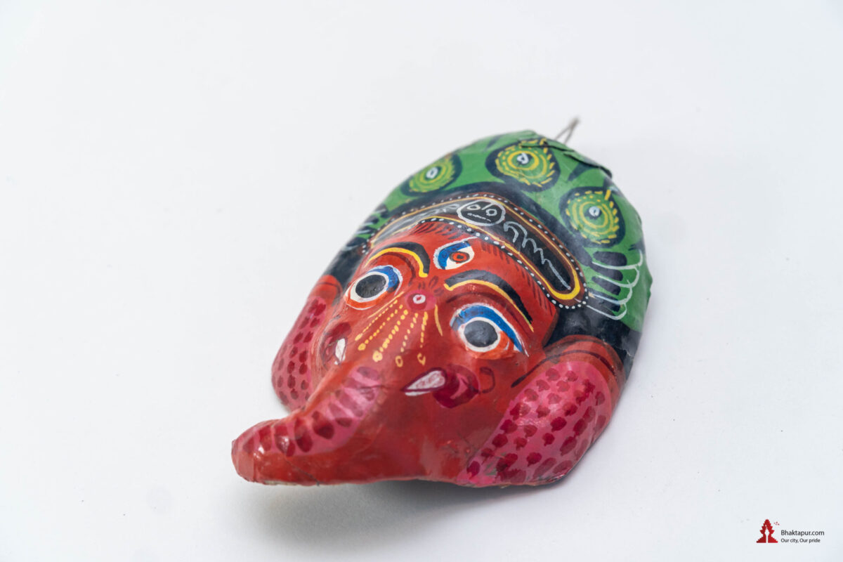 miniature clay mask of Ganesha