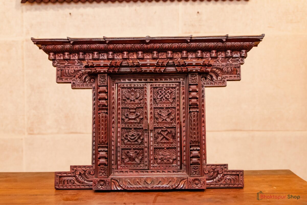 Miniature wooden doors with Astamangal symbols for decoration